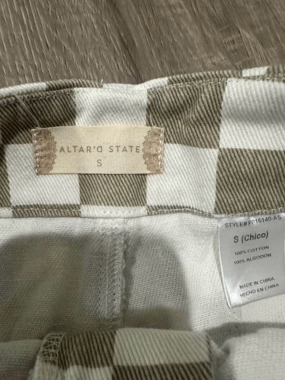 White and tan check jeans by Altar’d State